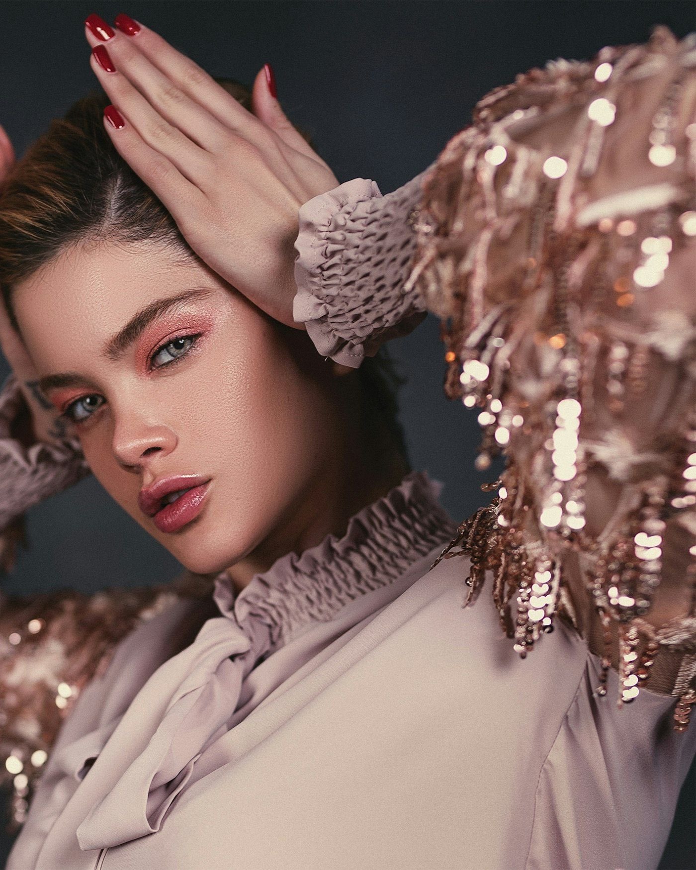 Model in rose sequins photographed in luxe editorial light