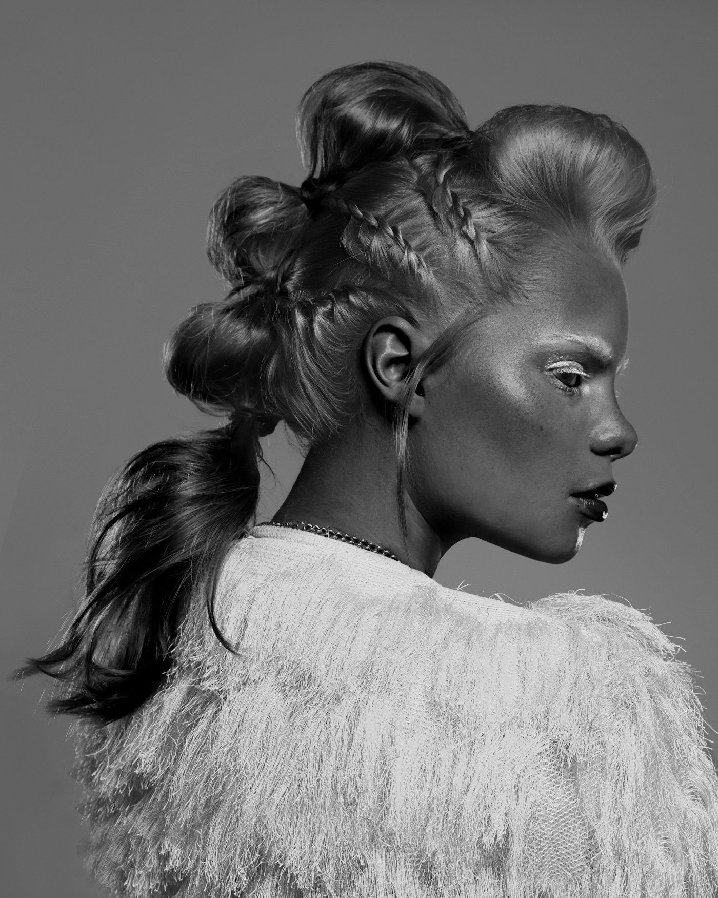 Black and white beauty portrait of a model with an elegant updo
