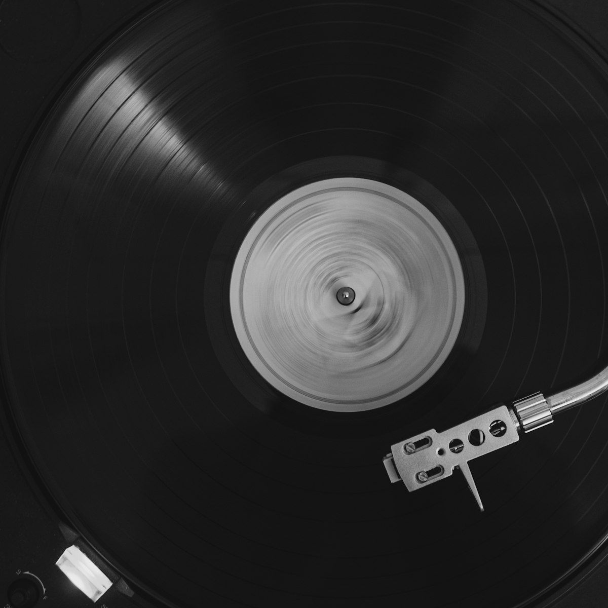 Top-down view of a spinning black vinyl record